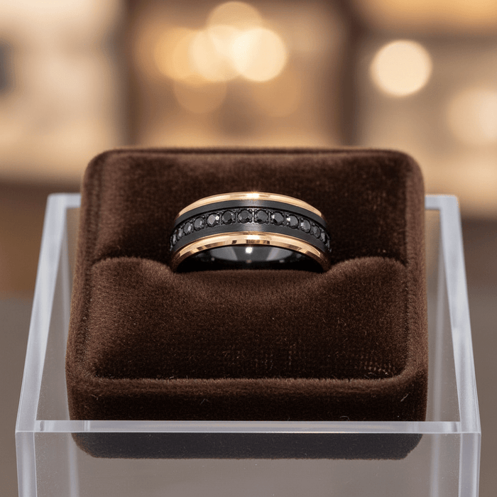 PASSINO black tungsten with rose gold edges black CZ eternity ring on dark velvet pillow boutique display