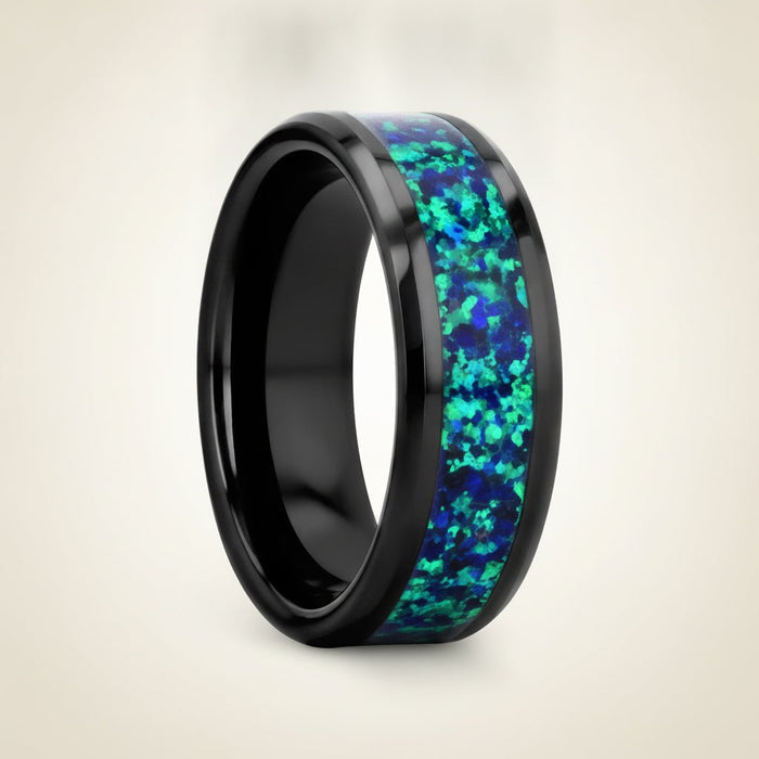PULSAR black ceramic wedding band with emerald green and sapphire blue color opal inlay running around the band and polished beveled edges, studio hero shot