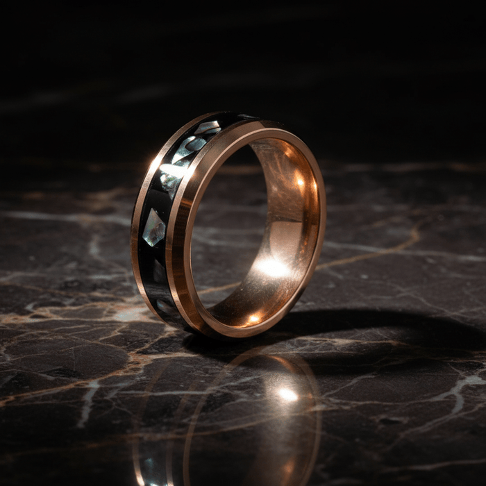 RESINOVA — Luxury 3/4 angle on dark marble — men's tungsten wedding ring.