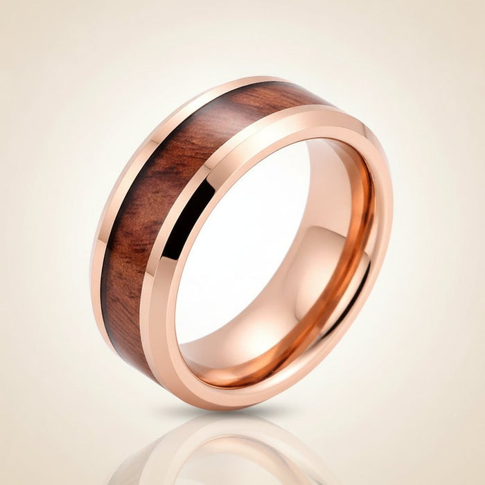RUSTIC rose gold plated tungsten carbide wedding band with hawaiian koa wood inlay running around the band and shiny polished beveled edges, studio hero shot