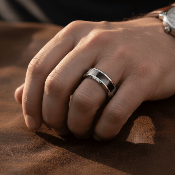 SCORPIO — Lifestyle photo on hand — men's tungsten wedding ring.