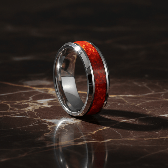 STARFALL — Luxury 3/4 angle on dark marble — men's tungsten wedding ring.
