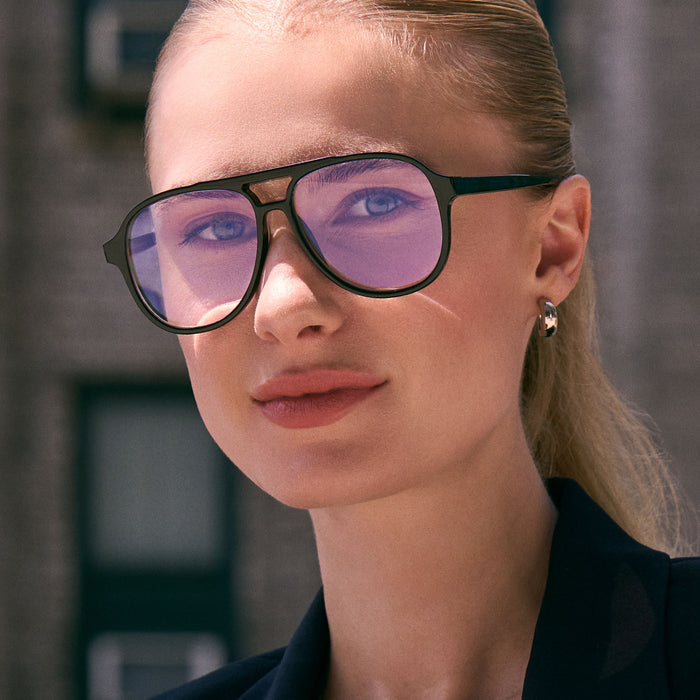on model - female wearing diff eyewear featuring the tatum aviator prescription glasses with a black frame angled view