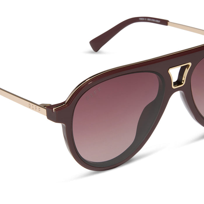 diff eyewear featuring the tosca iii aviator sunglasses with a rugby red acetate and gold accent frame and burgundy gradient polarized lenses detailed view