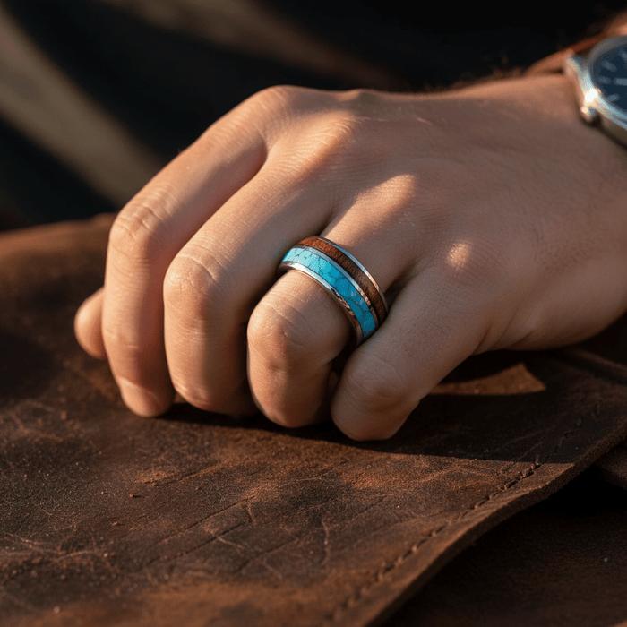 TURKOA — Lifestyle photo on hand — men's tungsten wedding ring.