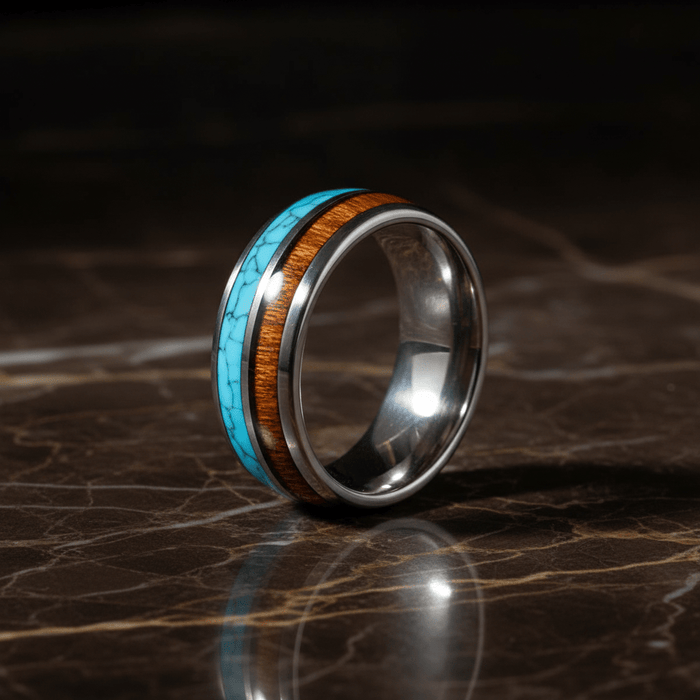 TURKOA — Luxury 3/4 angle on dark marble — men's tungsten wedding ring.