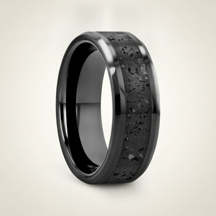 VESUVIUS polished black ceramic wedding band with black and gray lava rock stone inlay running around the band and polished beveled edges, studio hero shot