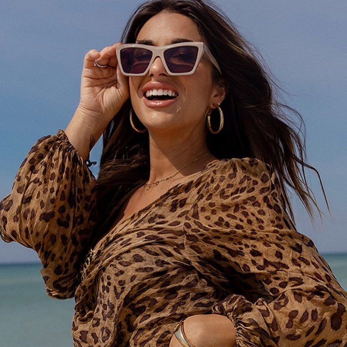 lifestyle - jessie james decker x diff eyewear featuring the vivi cat eye sunglasses with a almond brown frame and brown lenses front view