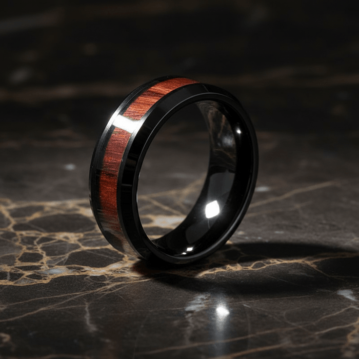 WARDEN — Luxury 3/4 angle on dark marble — men's tungsten wedding ring.